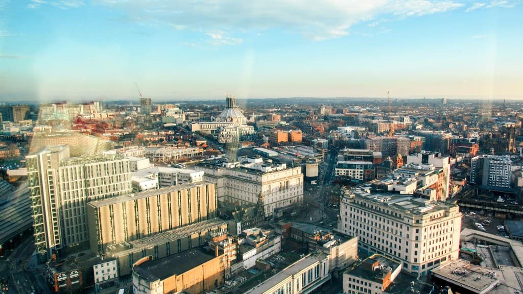 Aerial view of Liverpool cityscape under a bright sky