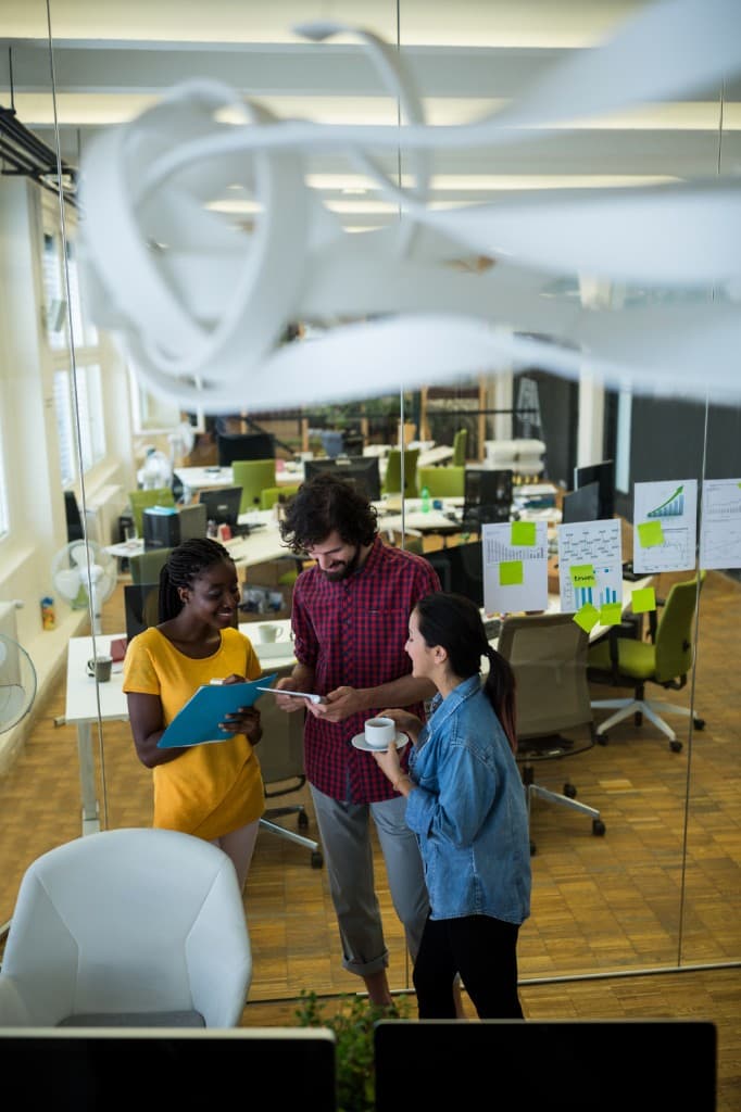 Remittance operations team collaborating in a modern office